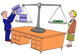A cartoon shows a man piling heavy "work" items onto one side of a scale, tipping it against the solitary "life" item on the other. A woman, embodying the patience and multitasking prowess of busy moms everywhere, stands nearby observing this unbalanced act.
